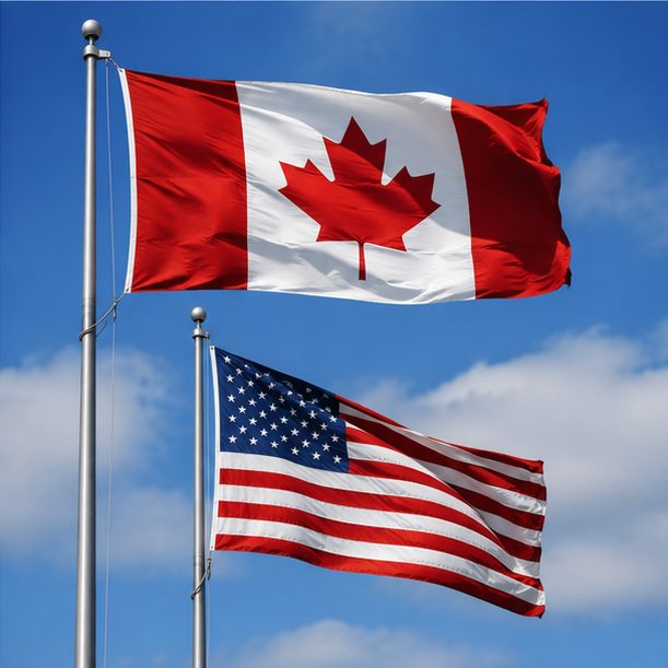 Canadian and American flags flying together